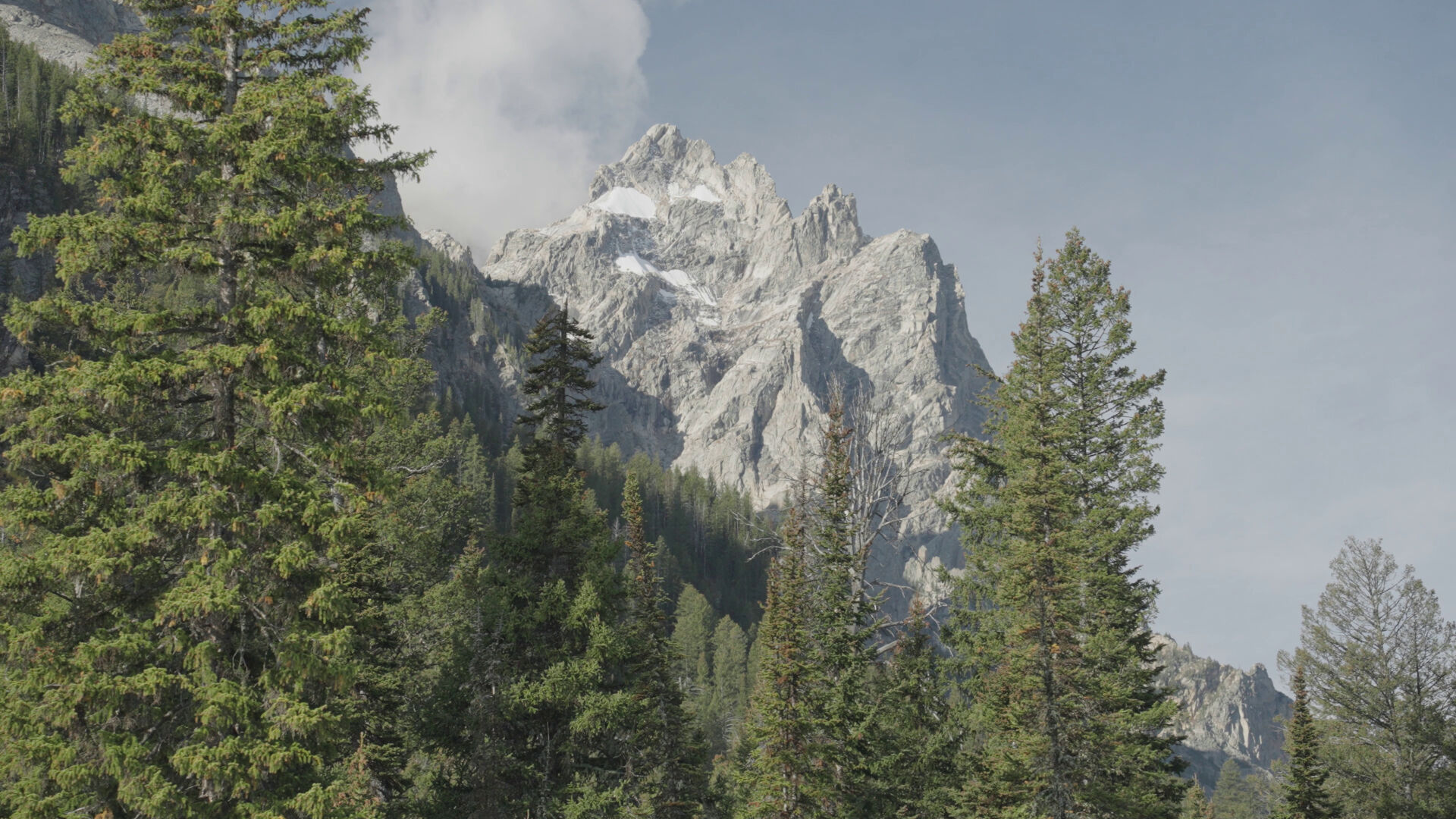 teewinot-mountain-and-mount-st-john-from-jenny-lake-shuttle-boat-in-grand-teton-nation-SBI-350603216.jpg